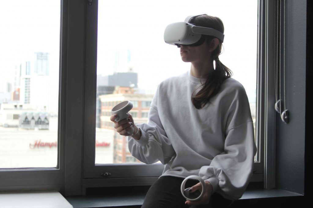 Workers collaborate in a VR office space