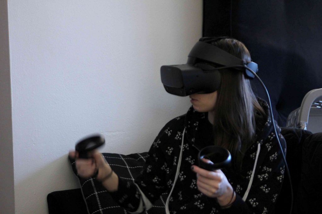 A worker develops a 3D design using VR software